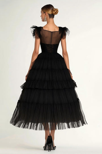Robe de soirée noire trapèze à manches flottantes et volants en tulle longueur thé